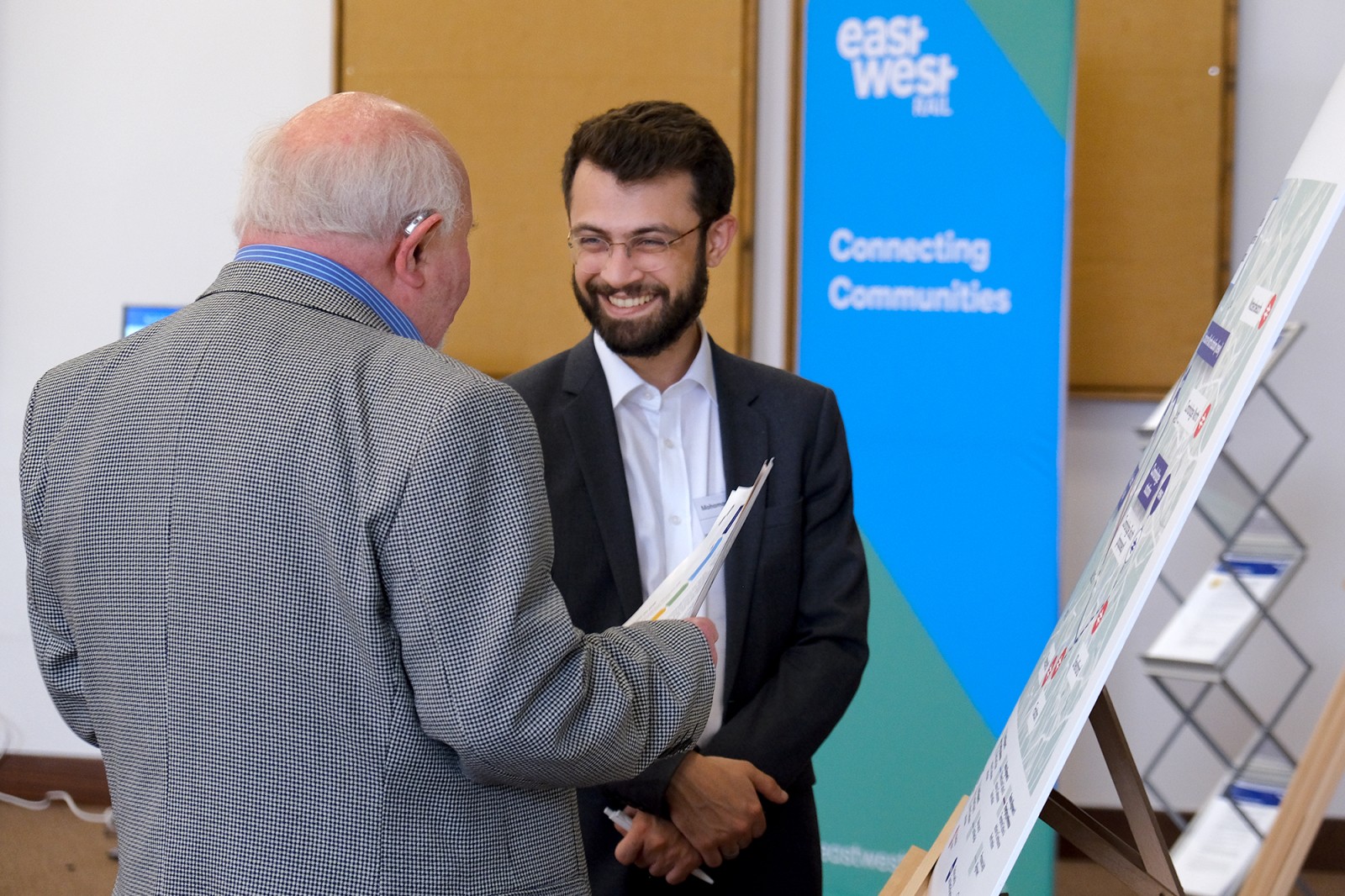 Image-of-EWR-colleague-speaking-to-resident-of-Bedford-at-community-event