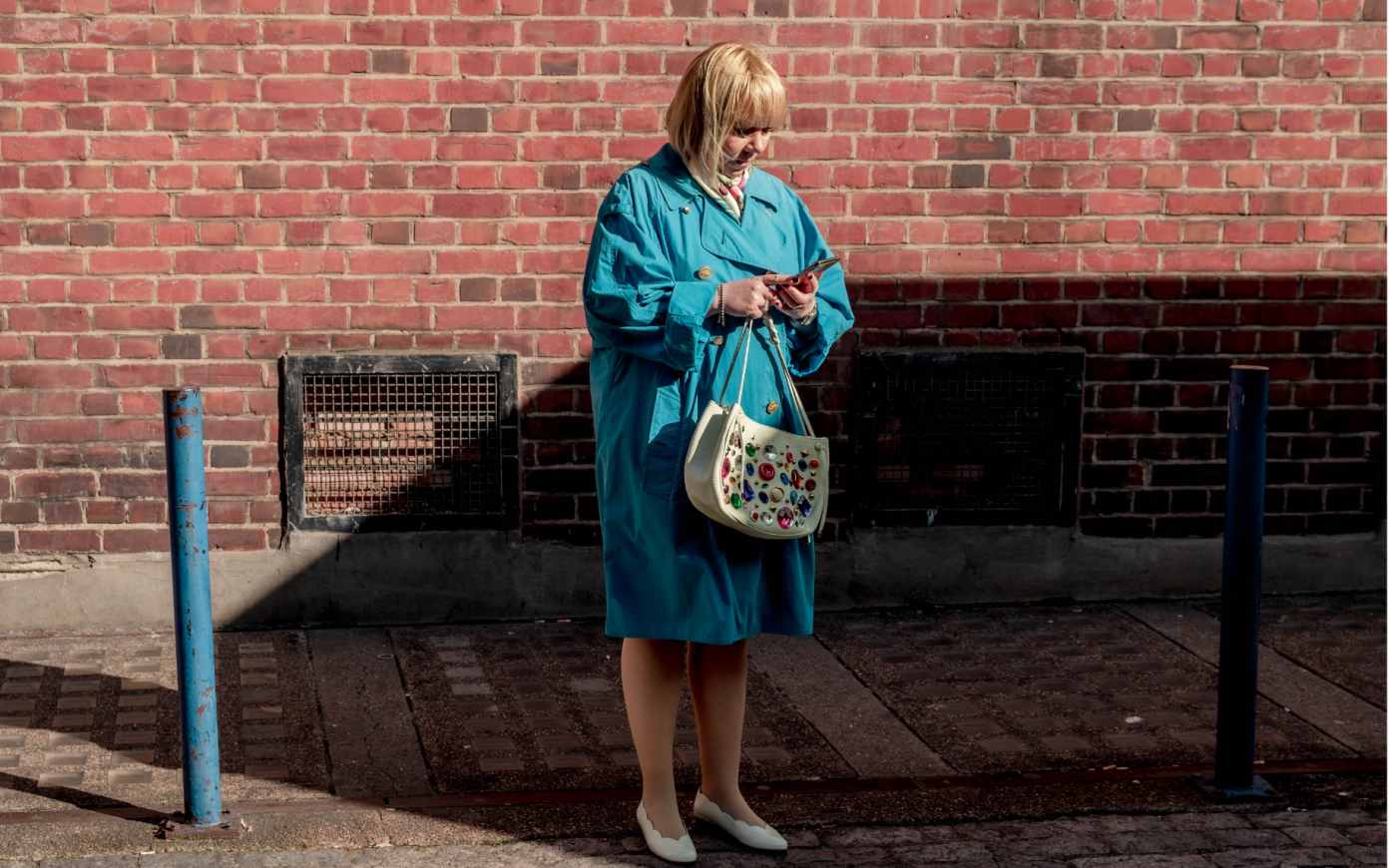 Long shot of Margarita in front of wall