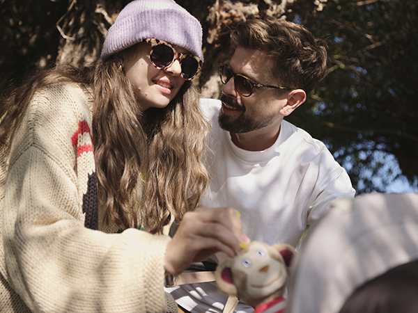 mother and father in front of pram