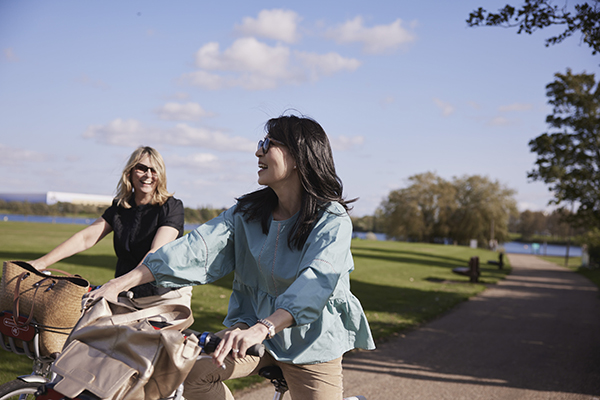 two woman riding bikes