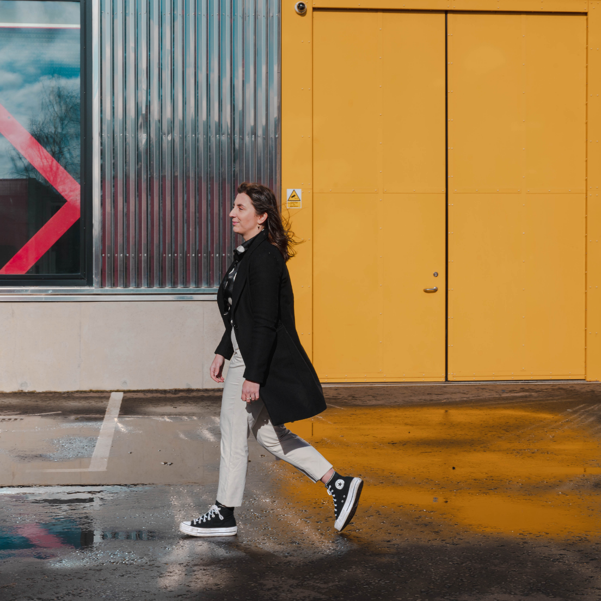 Ellen walking past a window