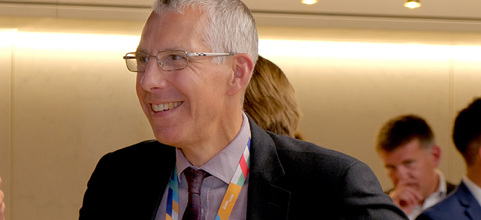 Headshot of SImon smiling