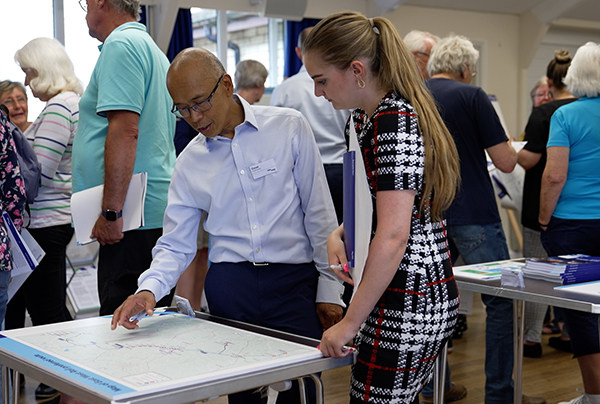 EWR colleague speaking to resident at event