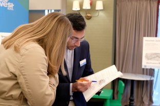 EWR colleague explaining map to person