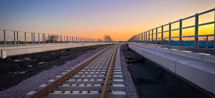 Image of train tracks with sunset in the background
