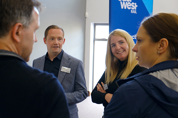 EWR colleagues speaking to man and woman