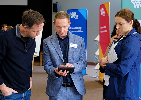 EWR colleague speaking to man and woman
