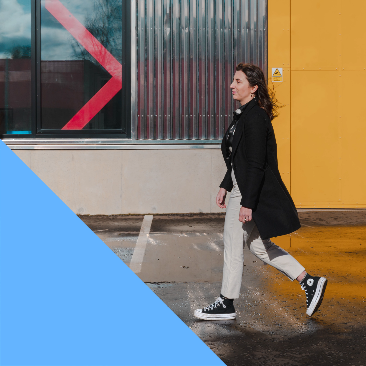 Ellen walking past a window